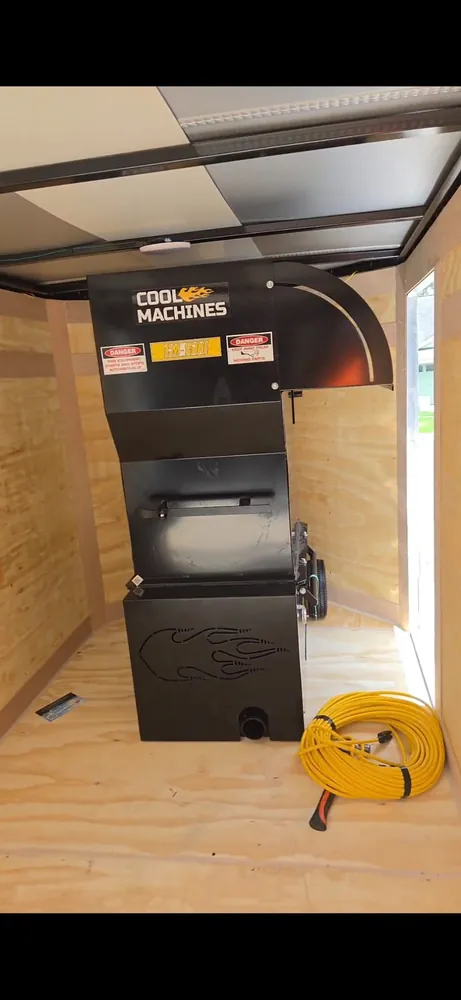 The Cool Machines CM-1500 commercial insulation blowing machine in the Arctic Attic trailer