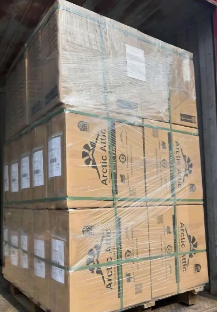 A pallet of boxed Arctic Attic branded solar fans